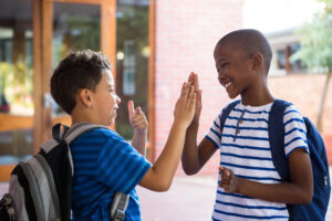 boys high-fiving