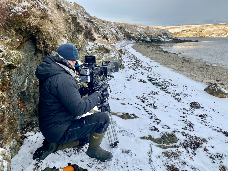 Raymond filming in snow. Photo: Brydon Thomason.