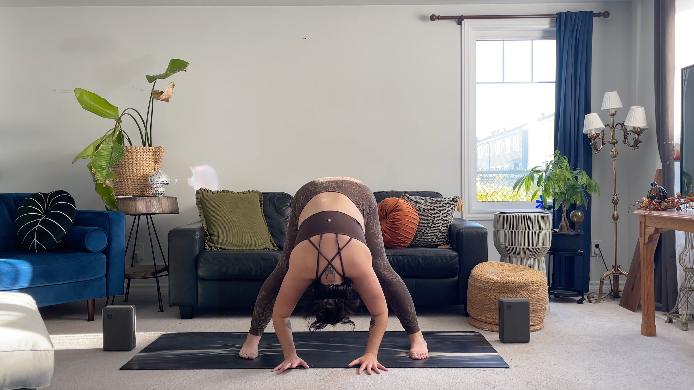 Teacher Taylor Lorenz in Wide-Legged Forward Bend