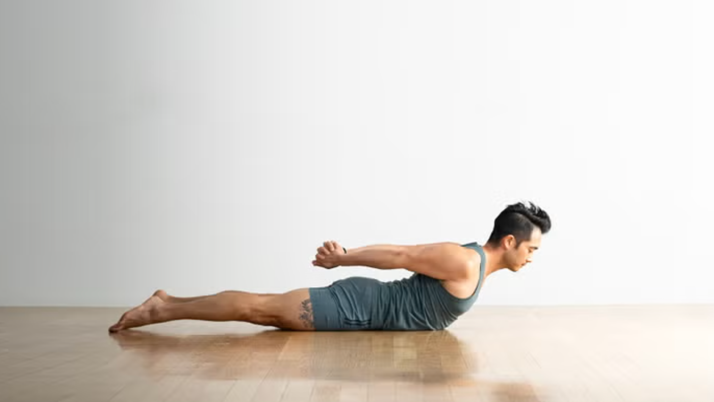 A woman in Locust Pose
